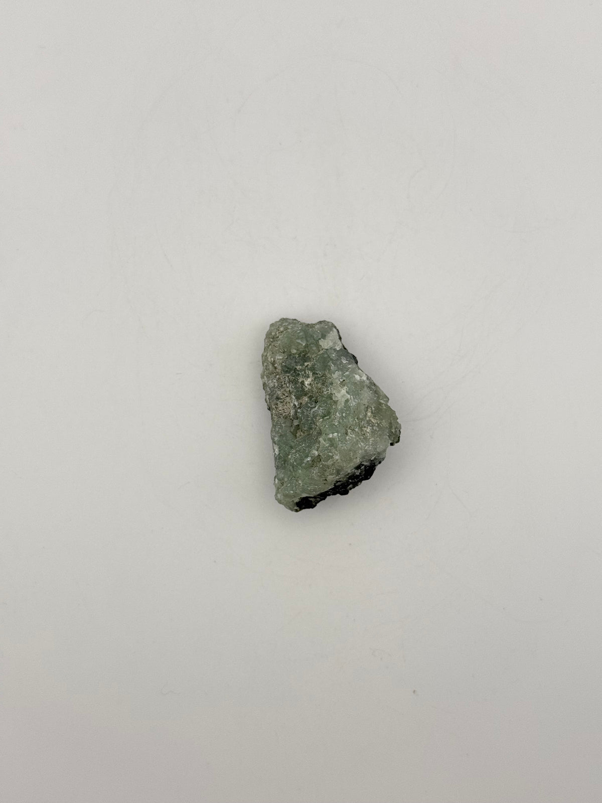 Raw Prehnite specimen with amazing green color.