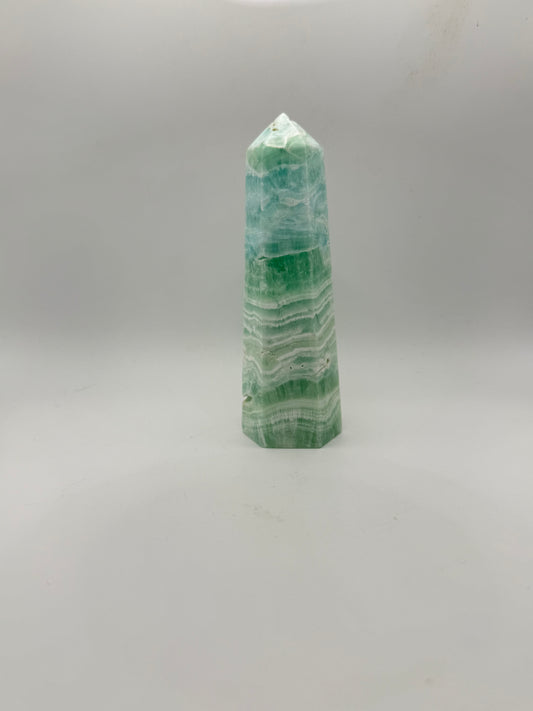 Caribbean Calcite polished six sided tower. This is 5.25 inches tall.
