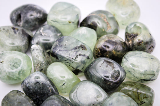 Assortment of prehnite tumbles.