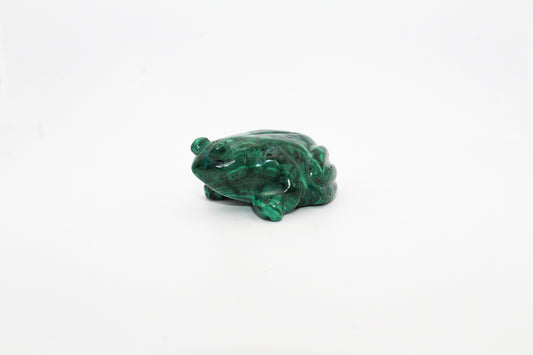 A small malachite stone sculpture shaped like a frog, displaying vibrant green color with swirling patterns.