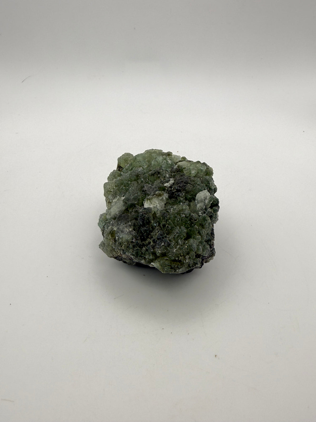 Raw Prehnite specimen with amazing green color.