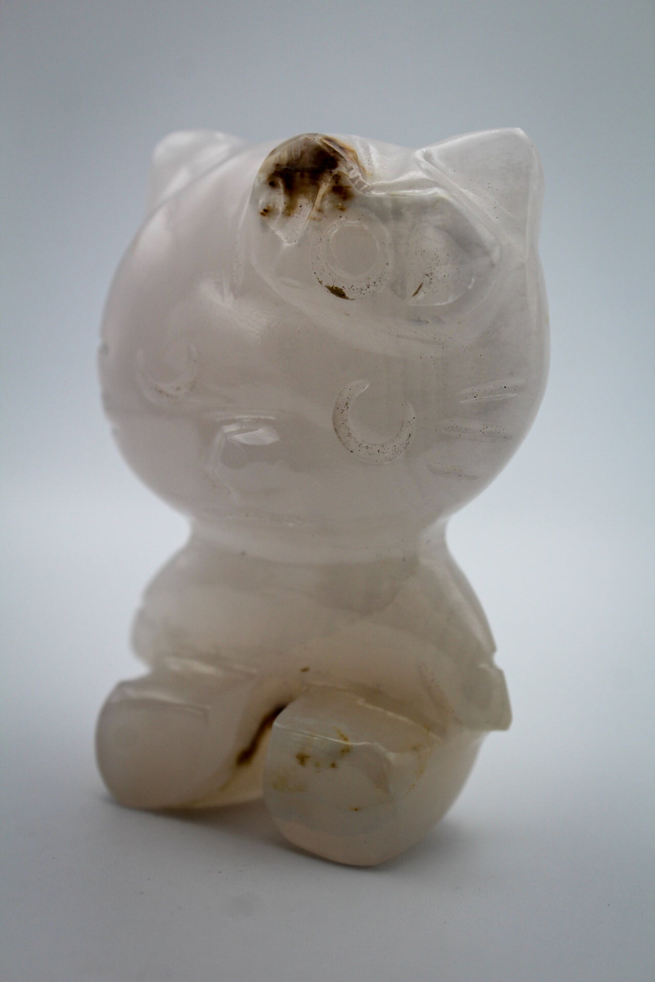 Pink Calcite crystal in the shape of Hello Kitty.