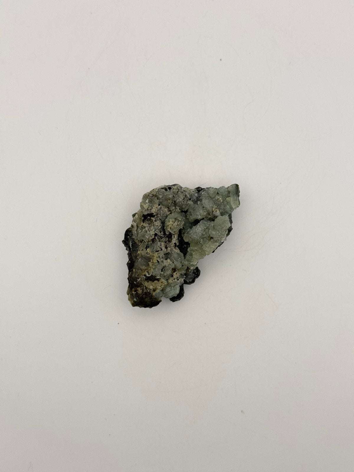 Raw prehnite specimen with amazing green color.