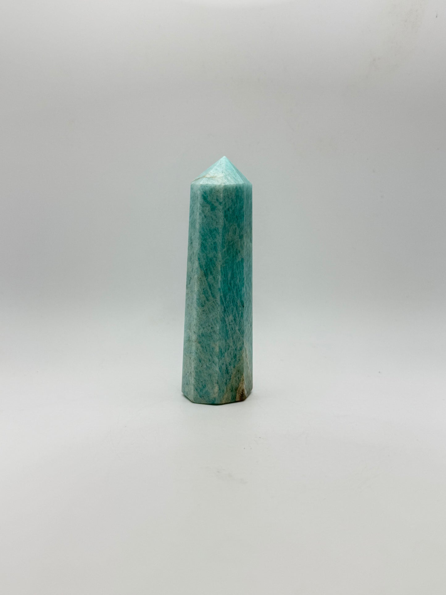 Amazonite tower with eight sides, that is about 4inches tall with a width of 1 1/4inches.