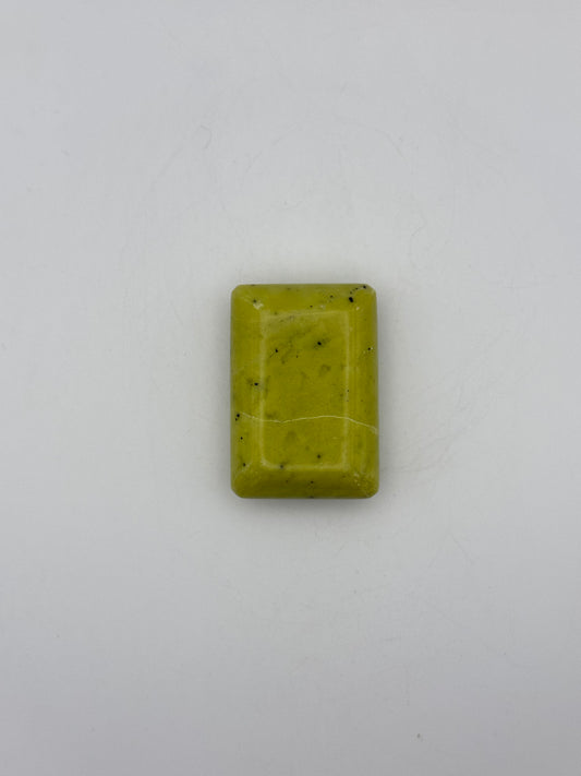 Polished healerite in the shape of a rectangular soap.