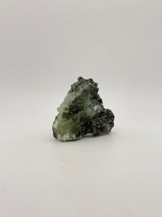 Raw Prehnite specimen with amazing green color.