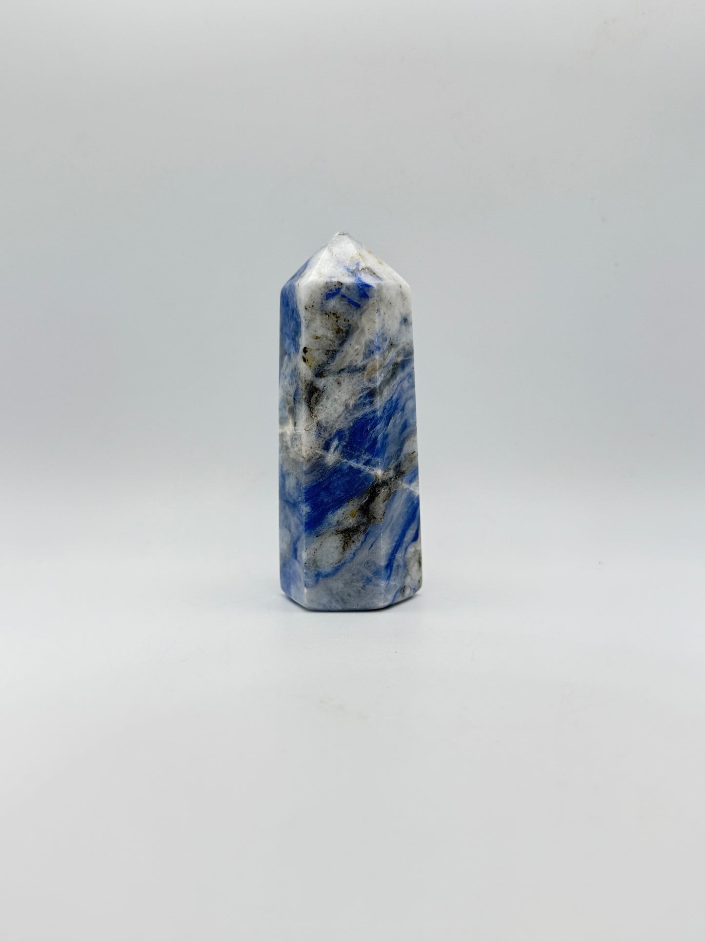 Afghanite six sided tower. Height of 3 3/4 inches, width of 1 1/2 inches.