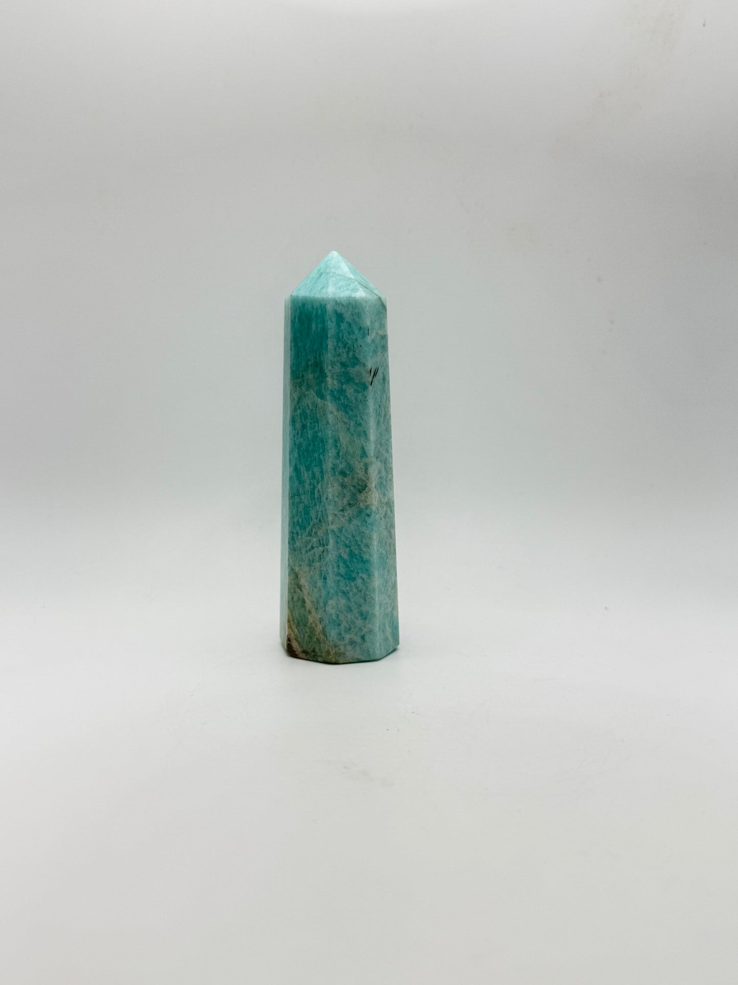 Amazonite tower with eight sides, that is about 4inches tall with a width of 1 1/4inches.