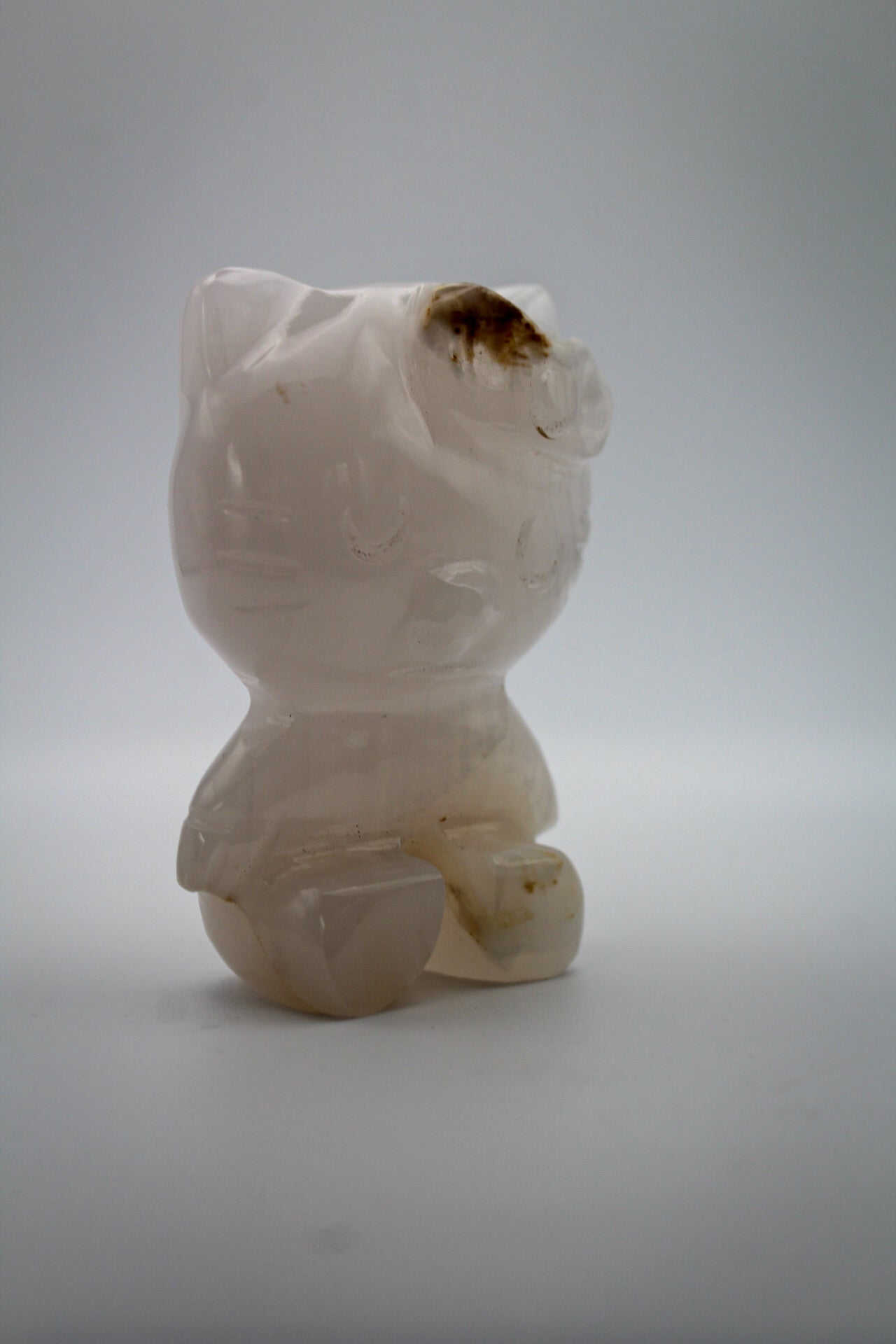 Pink Calcite crystal in the shape of Hello Kitty.