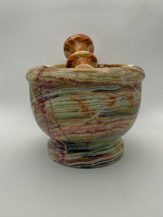 Mortar and pestle made out of onyx stone.