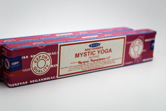 A package of Mystic Yoga incense with a red and white label, indicating 15 sticks per package.