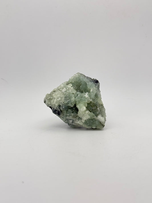 Raw Prehnite specimen with amazing green color.