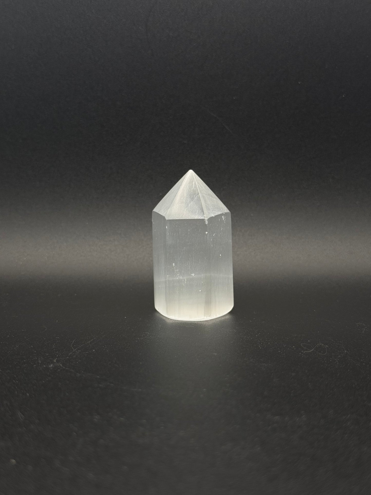 Selenite point that is 6cm tall.