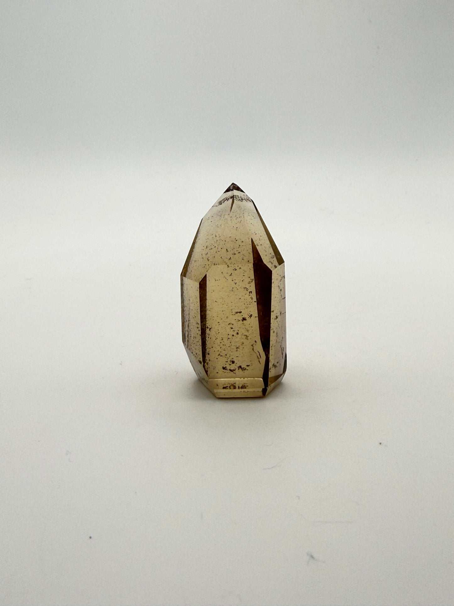 Polished natural citrine point.
