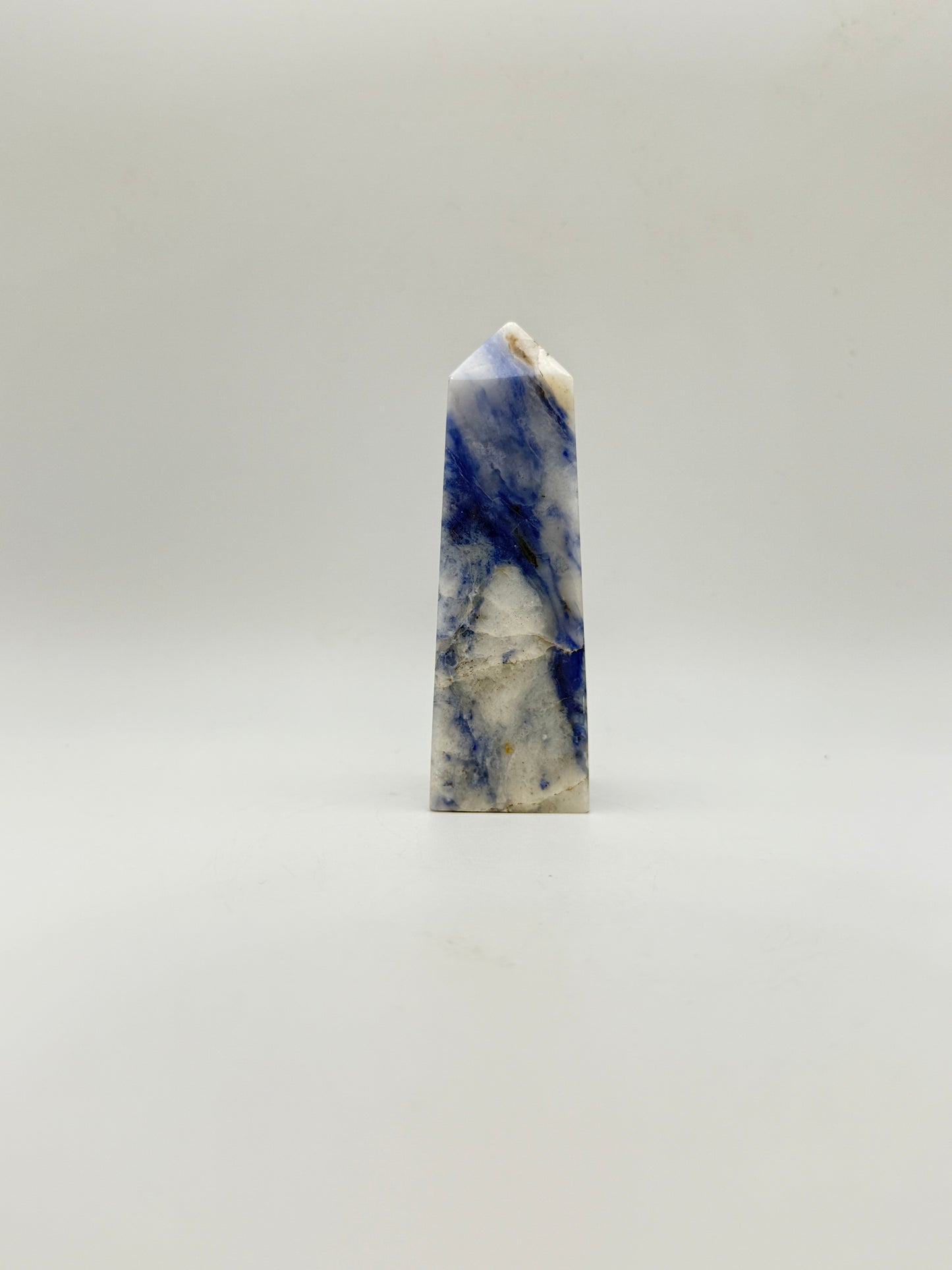 Afghanite four sided tower. Height of 3 5/8 inches, width of 1 1/8 inches.
