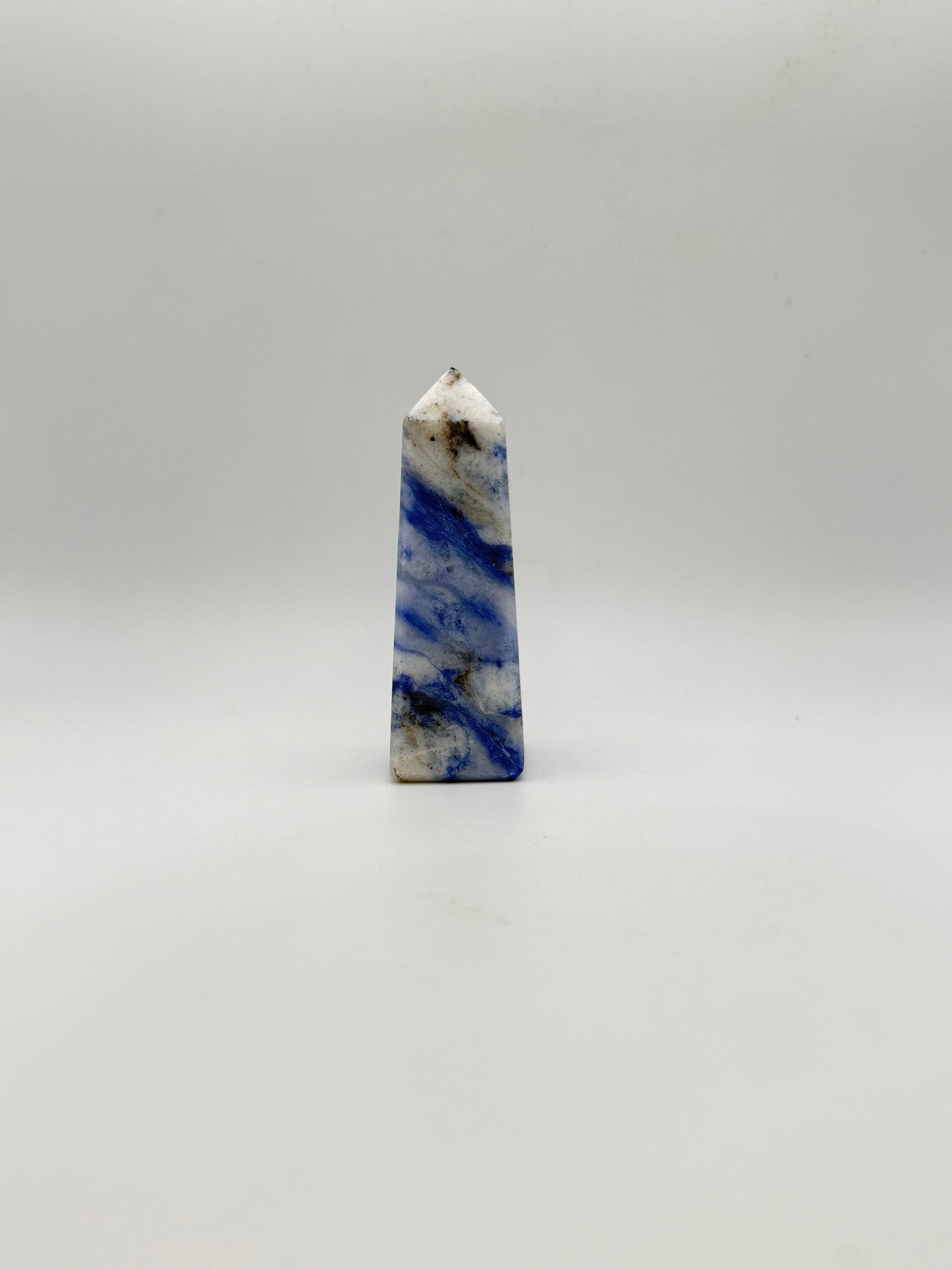 Afghanite four sided tower. Height of 3 1/4 inches, width of 1 1/4 inches.
