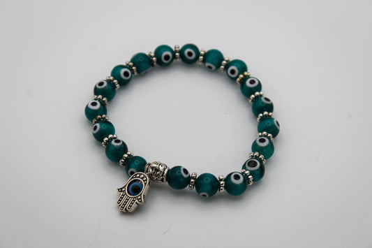 Collection of teal colored evil eye bracelets.