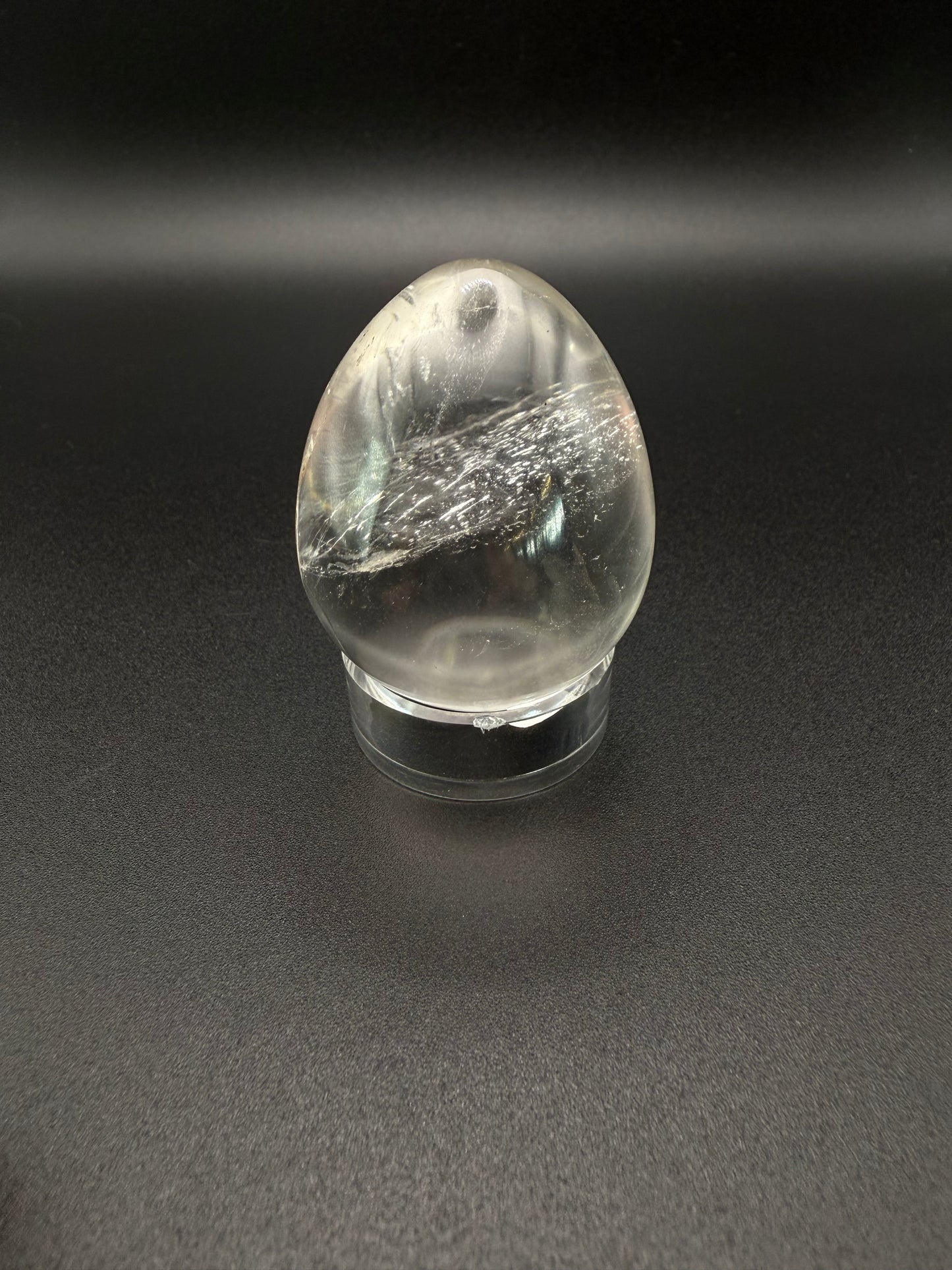 Clear quartz polished crystal in an egg shape.