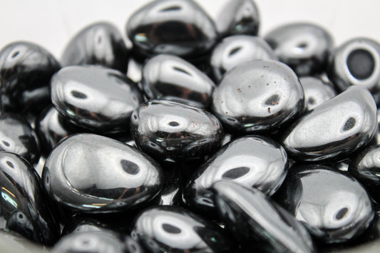 A collection of polished hematite tumbles.