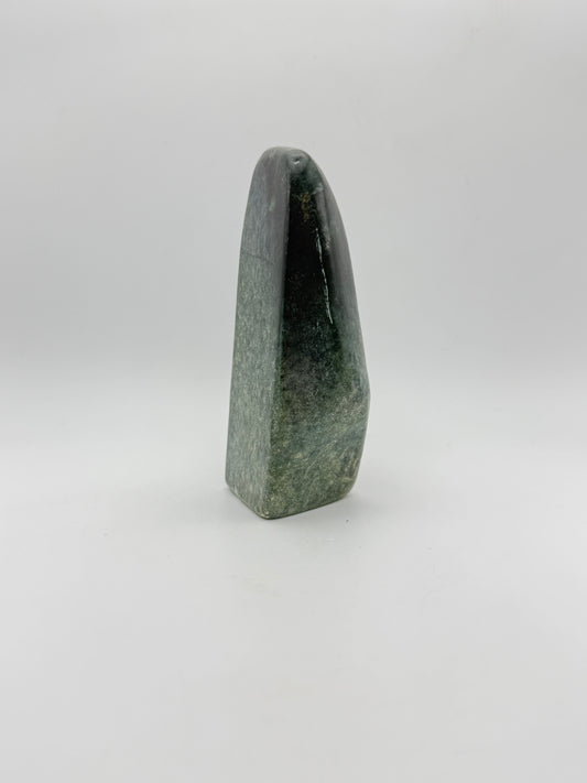 Polished green jade free form.