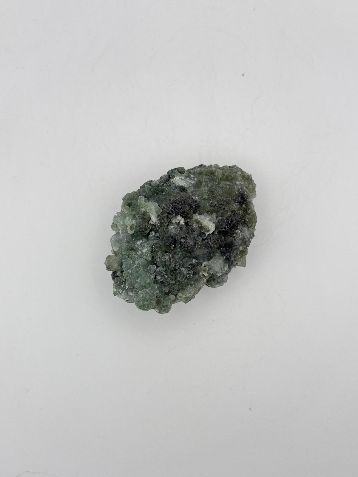 Raw Prehnite specimen with amazing green color.