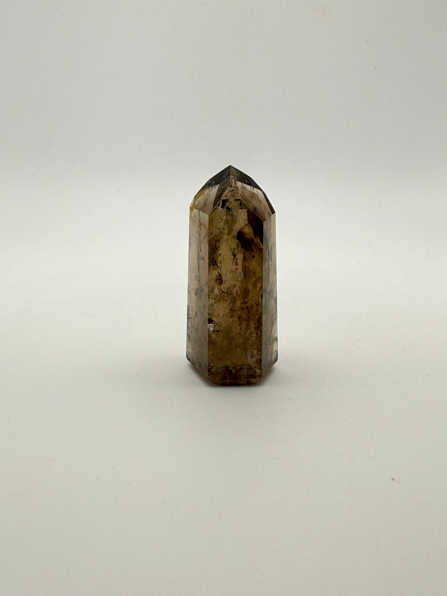 Polished natural citrine point.