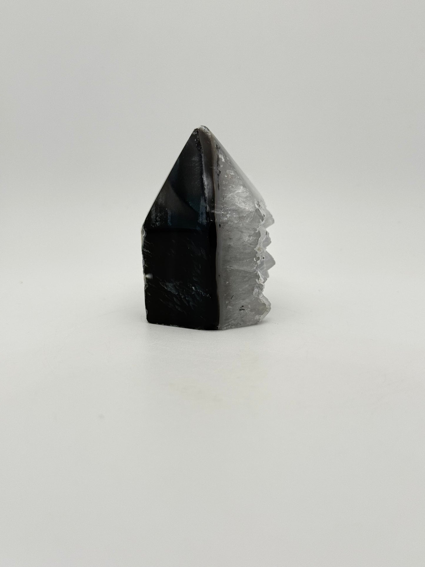 Polished druzy agate tower. About 2.25 inches tall.