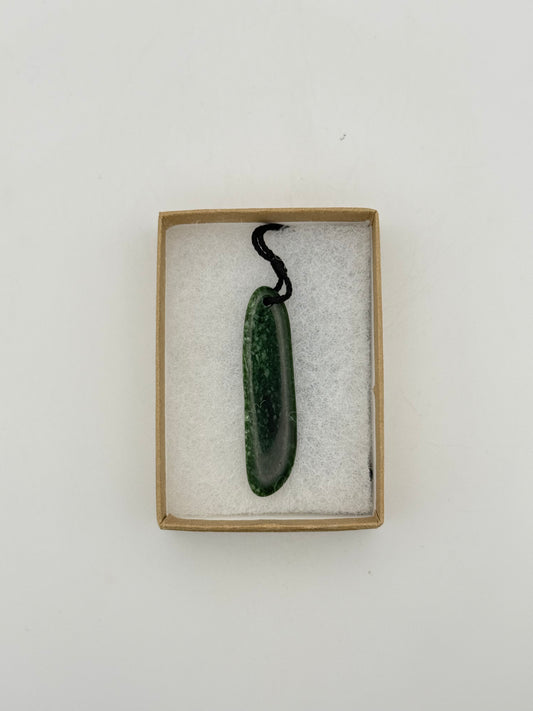 Green Jade pendant with string necklace.