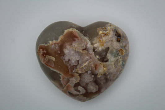 Polished flower agate in the shape of a heart.