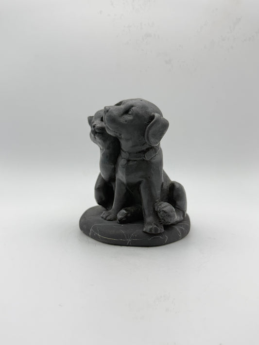 Shungite carving of a cat and dog.