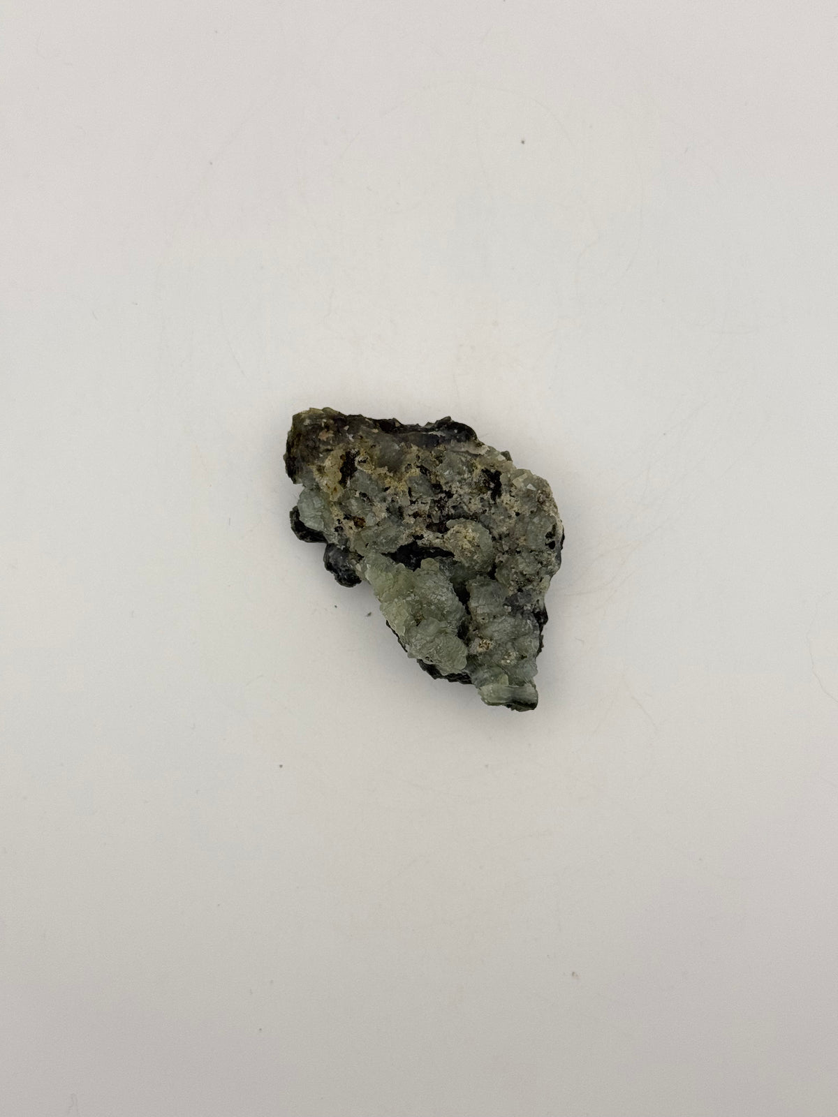 Raw prehnite specimen with amazing green color.