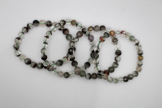 A series of round garden quartz bracelets.
