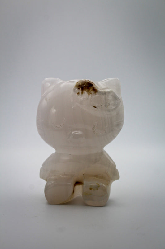 Pink Calcite crystal in the shape of Hello Kitty.