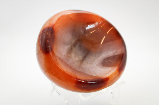Polished carnelian crystal shaped into a bowl.