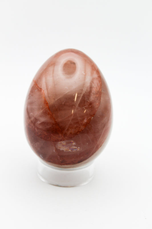 A polished red hematoid egg mineral specimen.