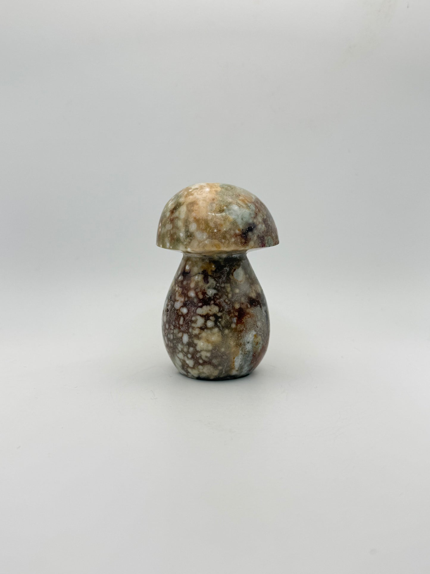 Ocean jasper stone in the shape of a mushroom.