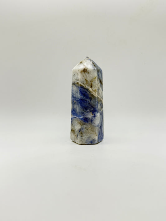 Afghanite six sided tower. Height of 3 3/4 inches, width of 1 1/2 inches.