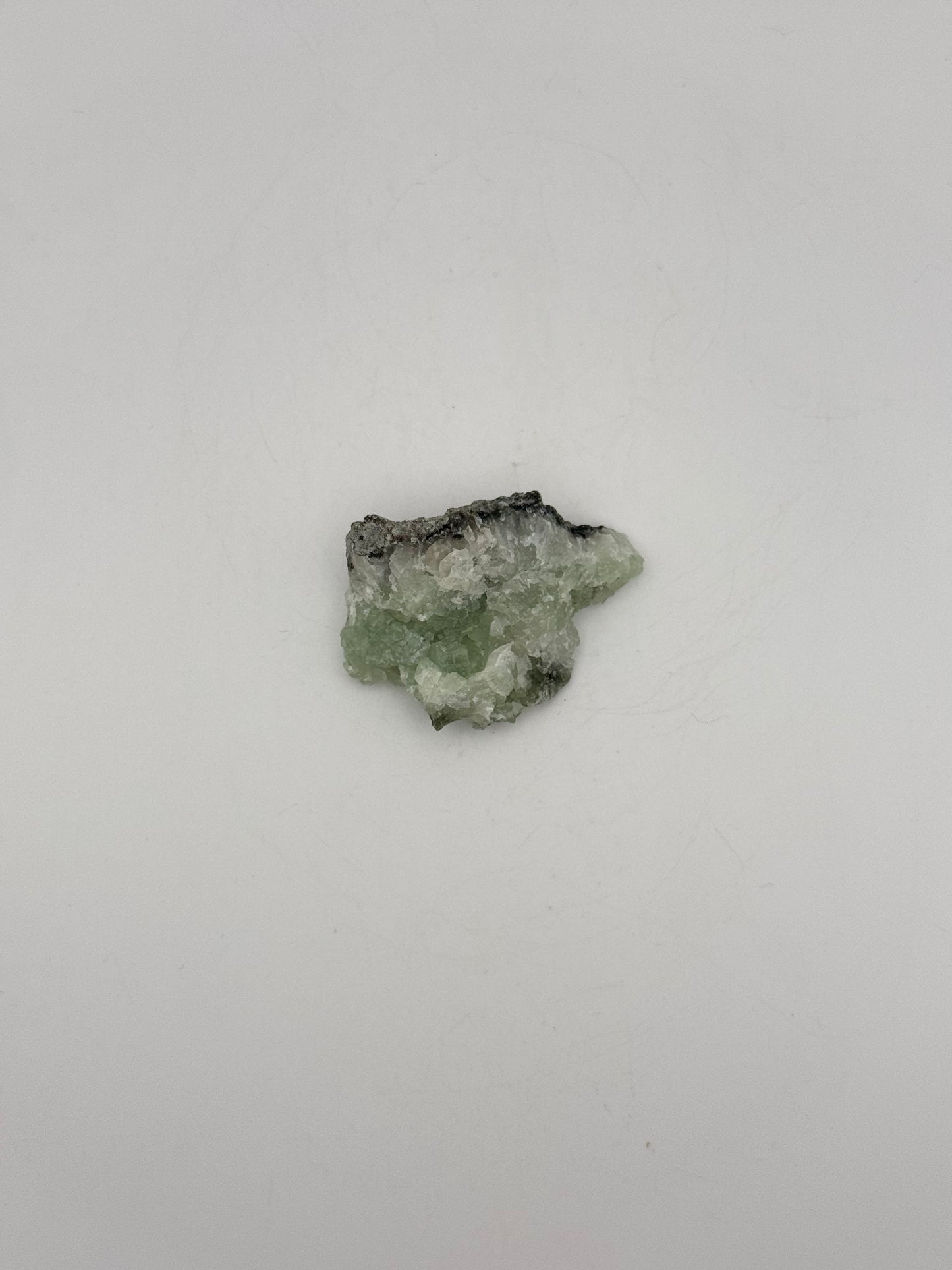 Raw prehnite specimen with amazing green color.
