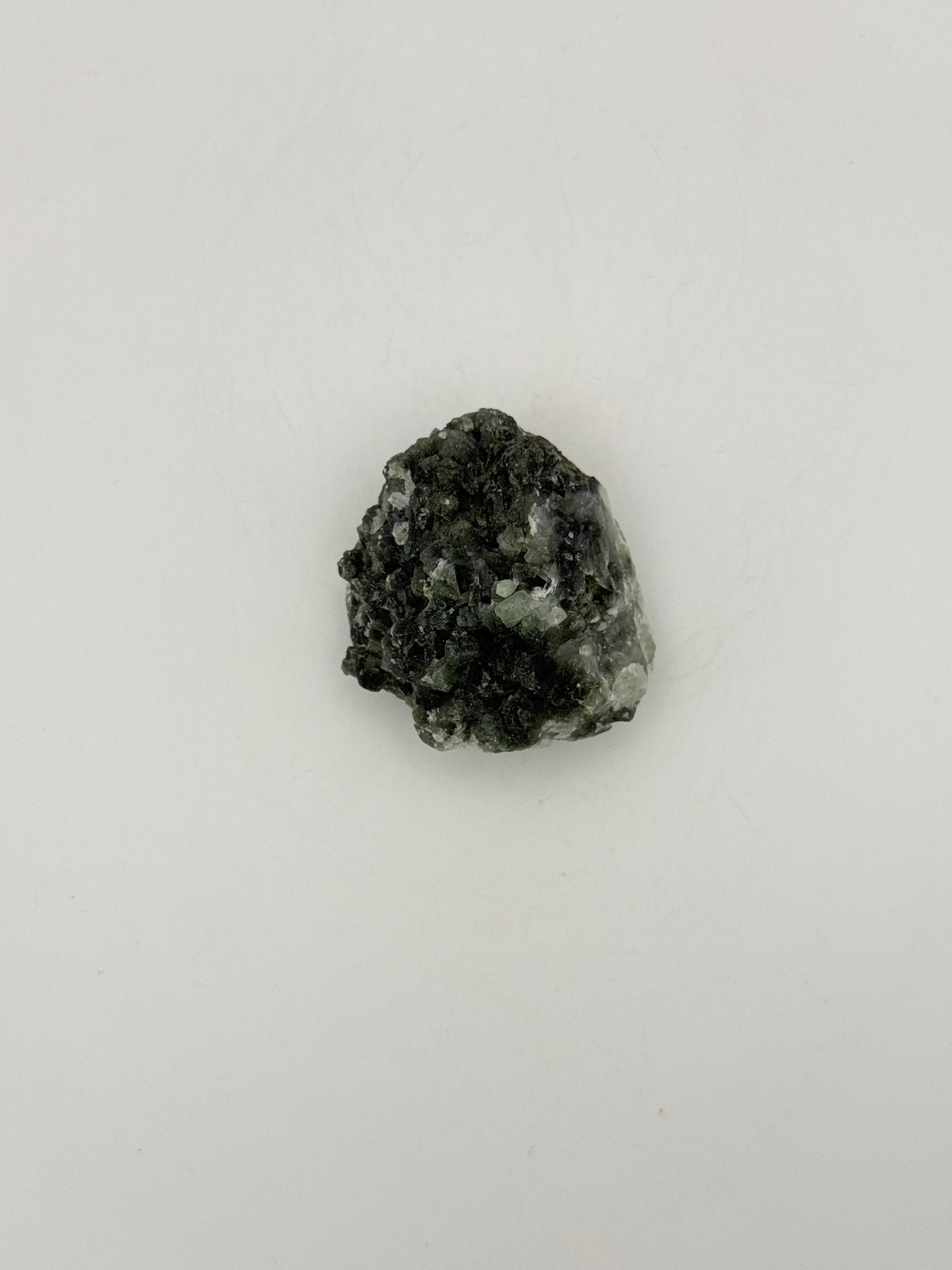 Raw Prehnite specimen with amazing green color.