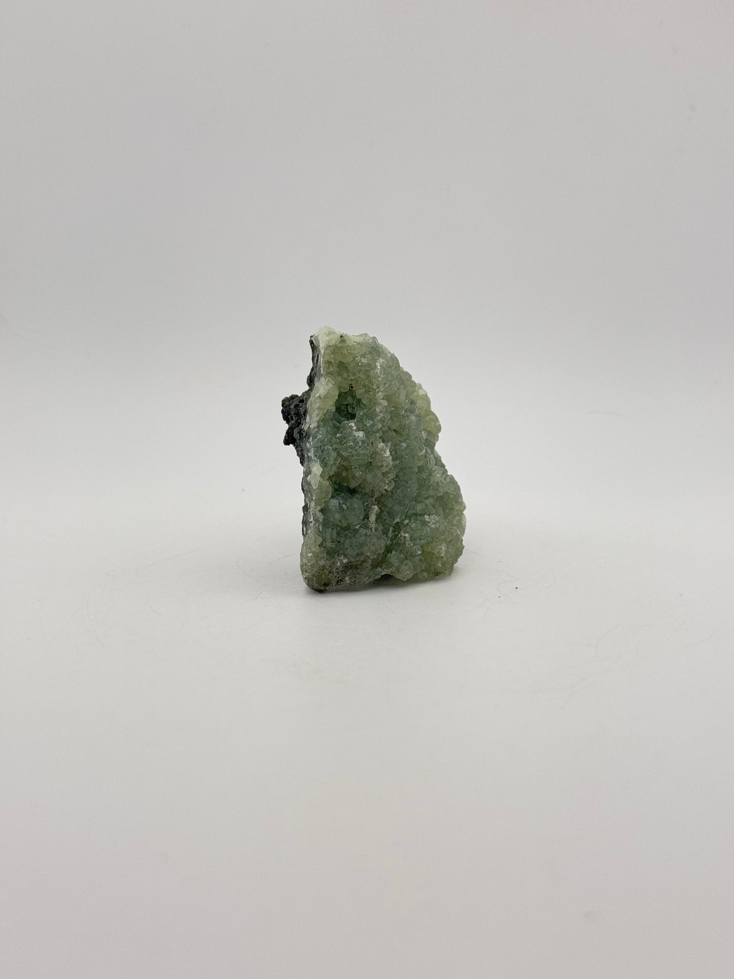 Raw Prehnite specimen with amazing green color.