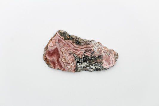 A polished rhodochrosite crystal slice.