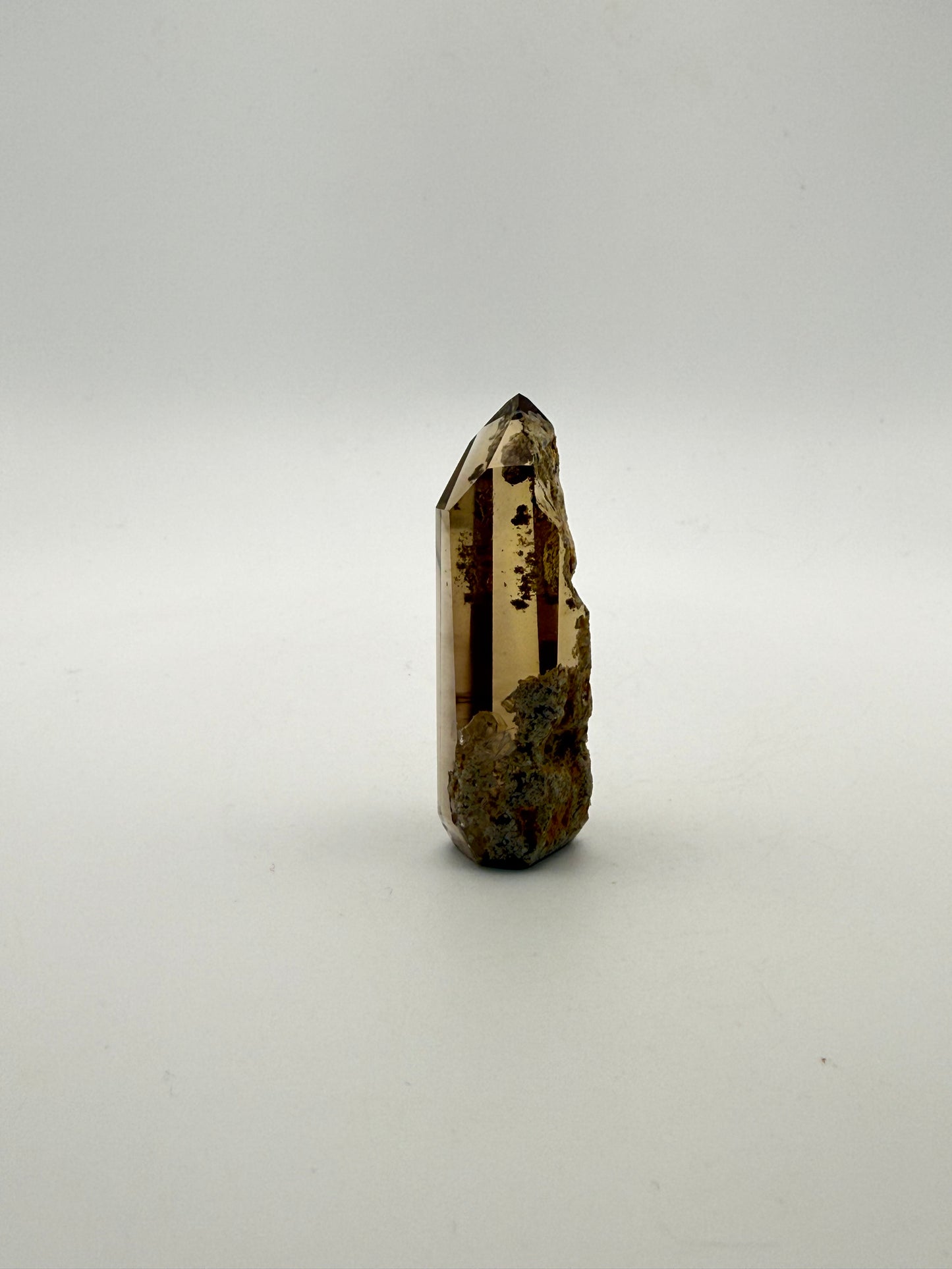 Polished natural citrine point.