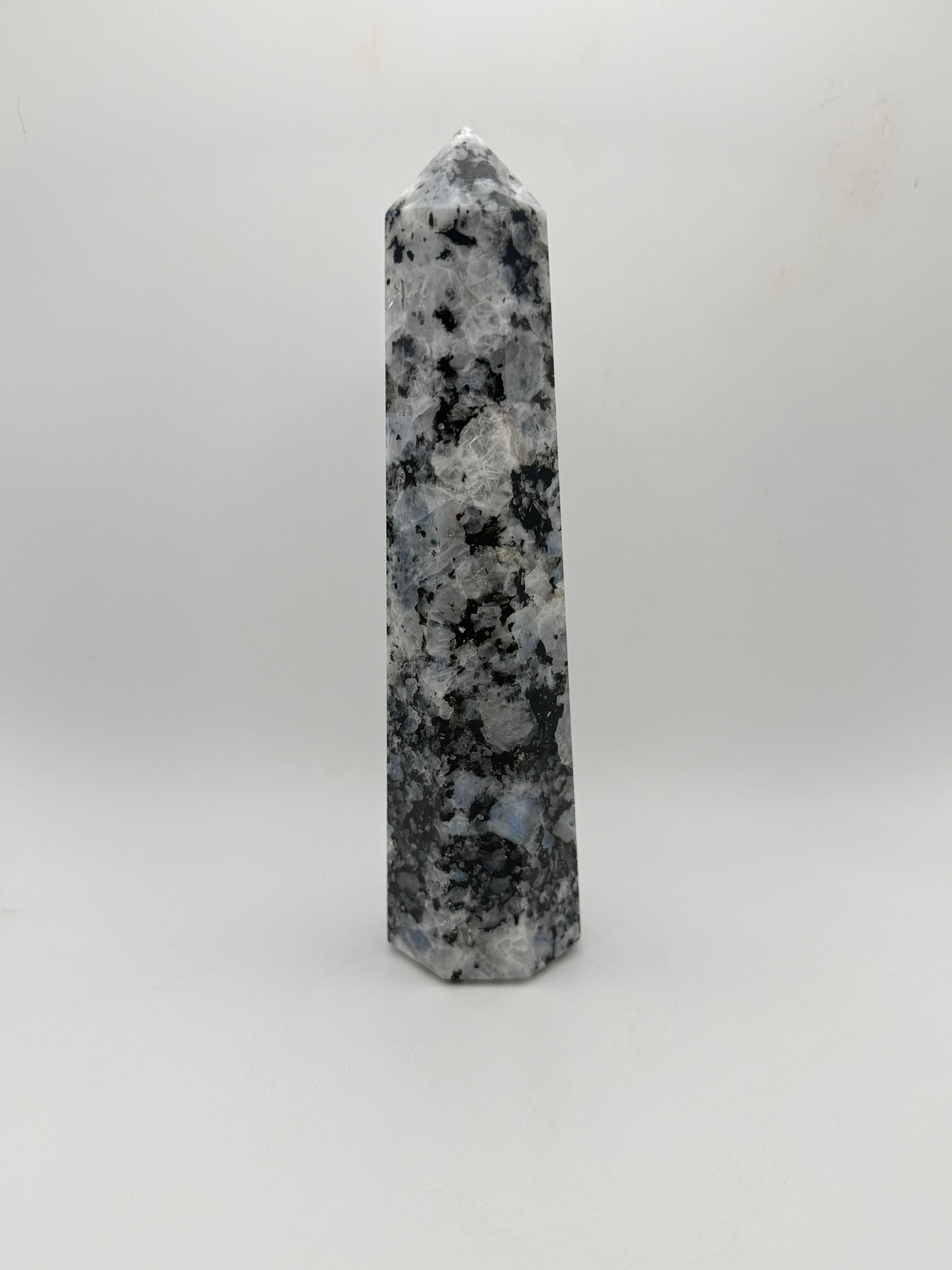 Rainbow moonstone polished tower with nice flashes of blue.
