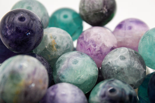 Rainbow Fluorite spheres with amazing green, blue, and purple colors.