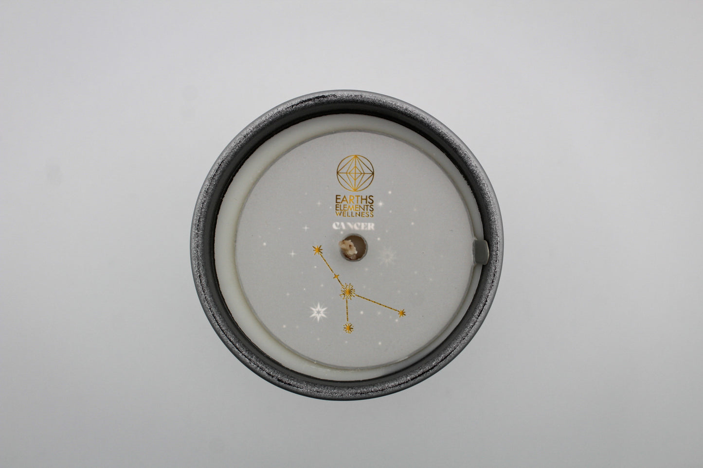 Candle with the theme of the cancer zodiac sign.
