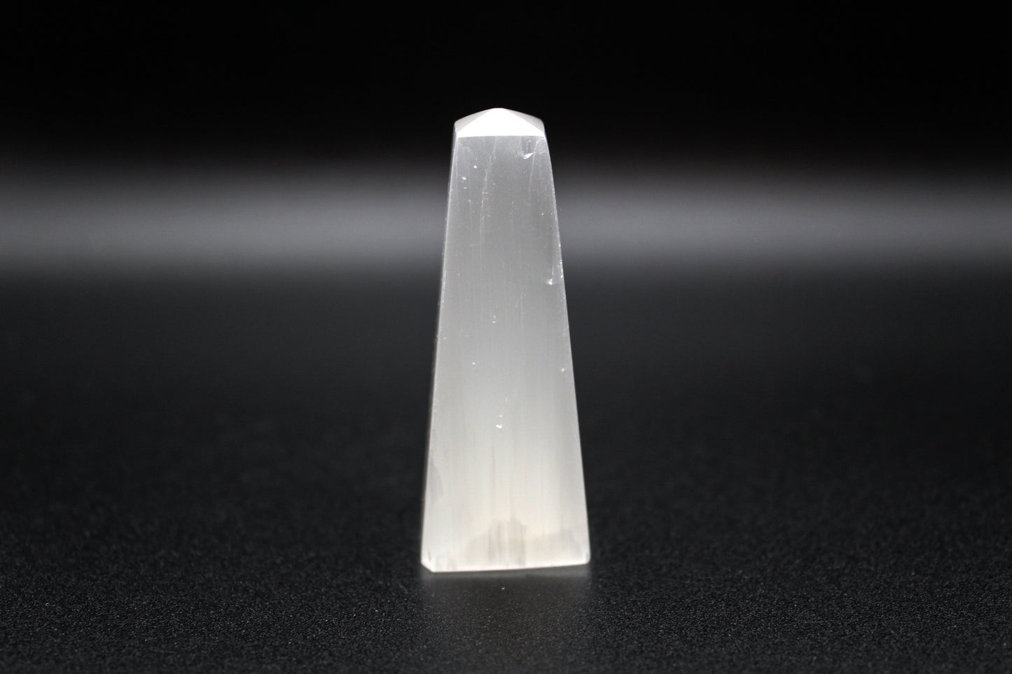 Selenite tower that is 6cm tall.
