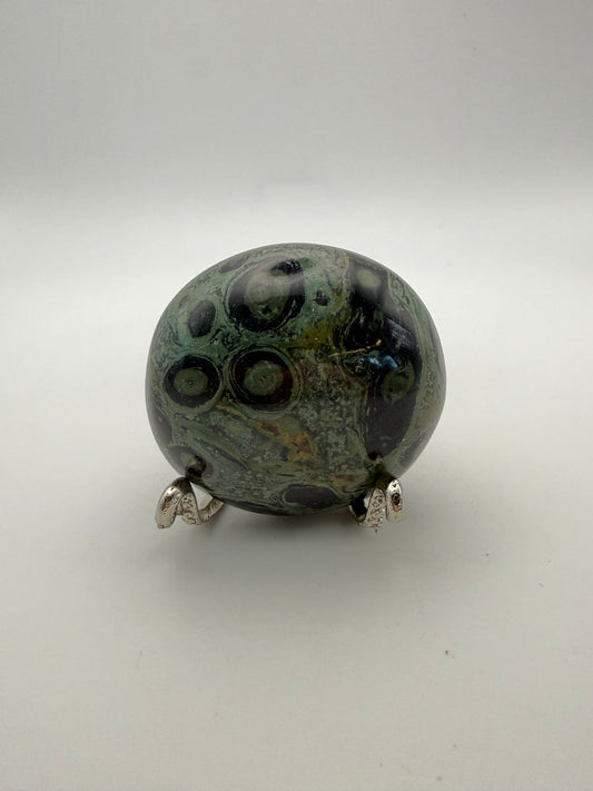 Polished kambaba jasper palm stone.