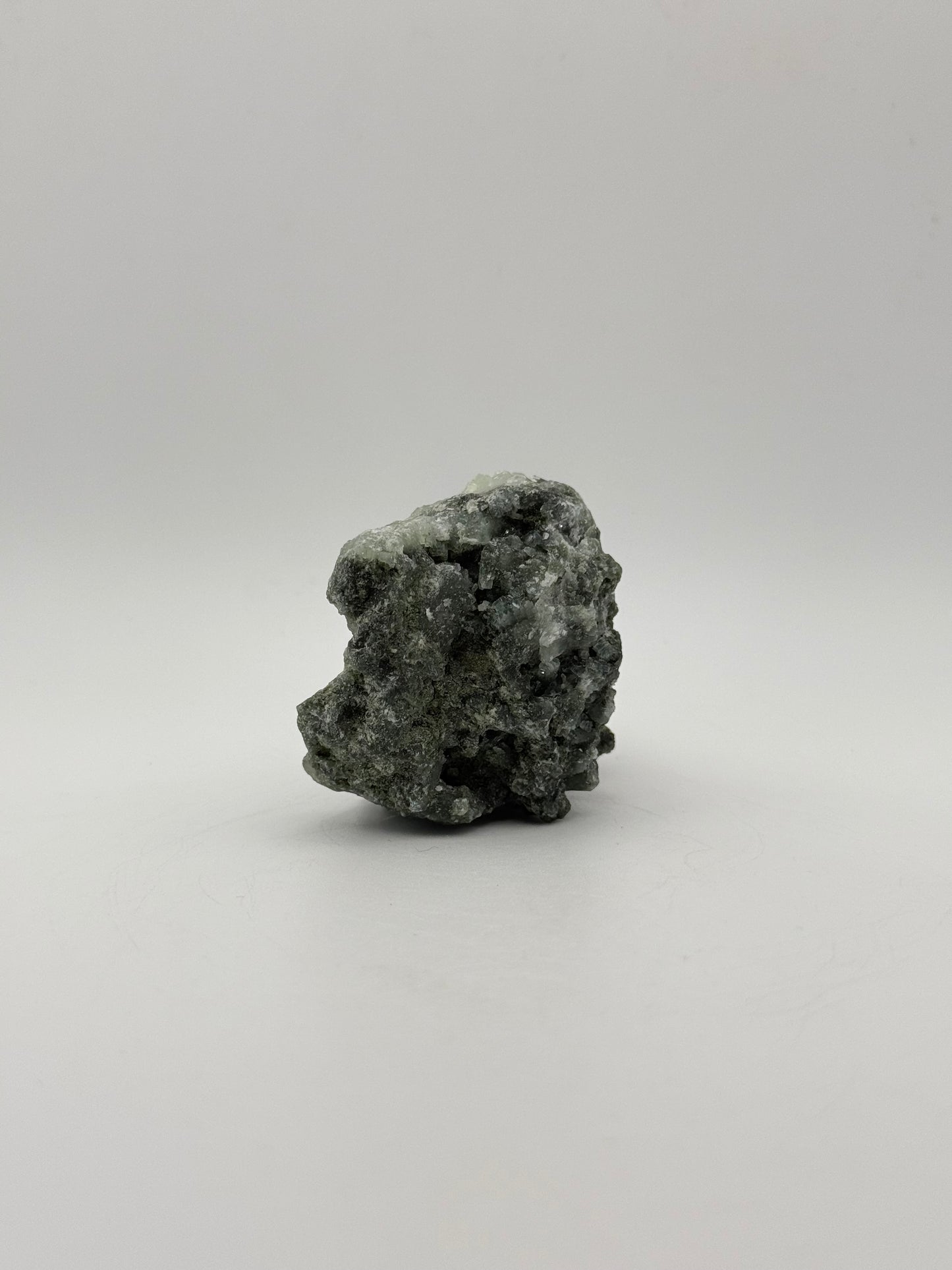 Raw prehnite specimen with amazing green color.