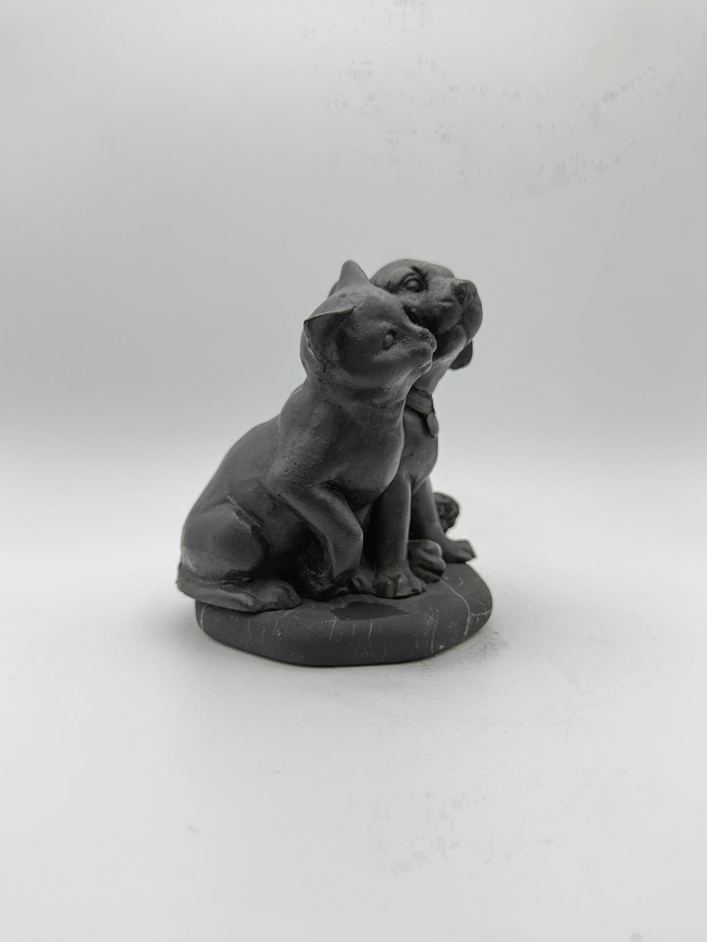 Shungite carving of a cat and dog.