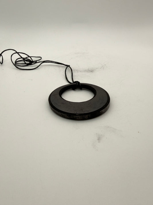 Shungite circle in circle pendant.